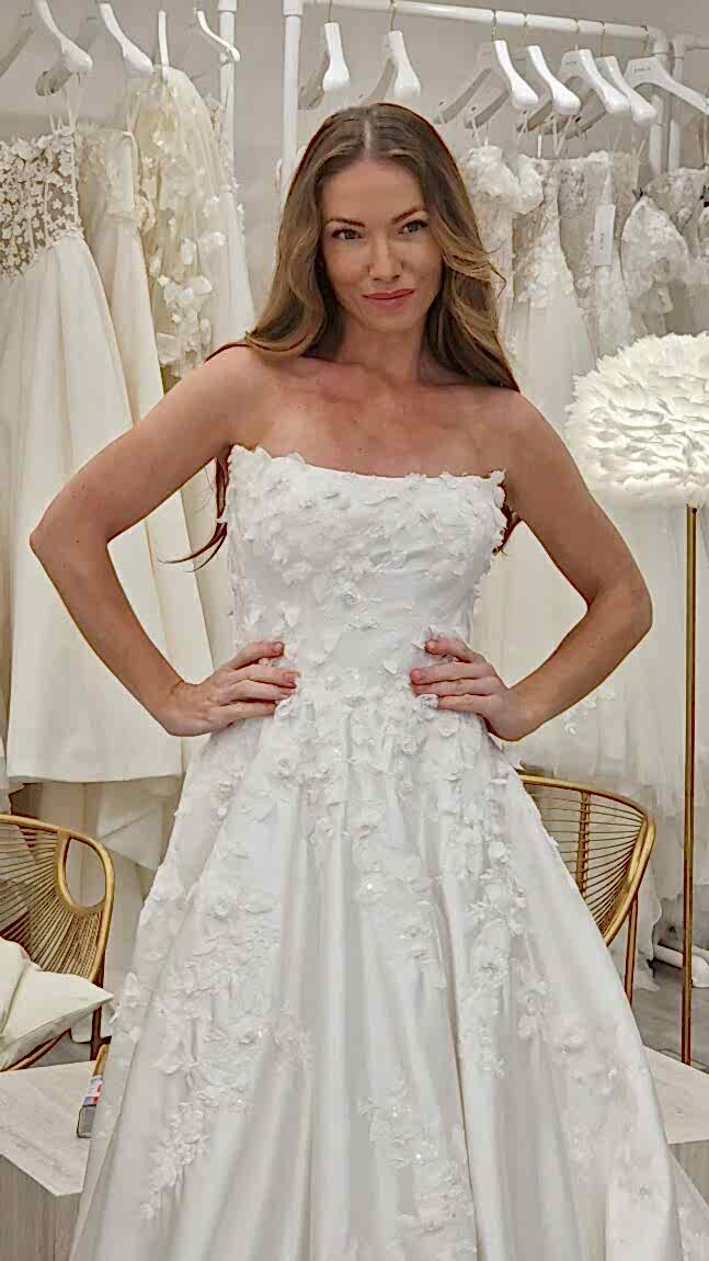 April Banbury trying on Justin Alexander Signature Muna