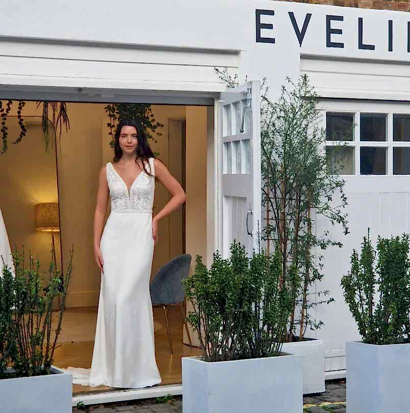 Evelie bride trying on a wedding dress